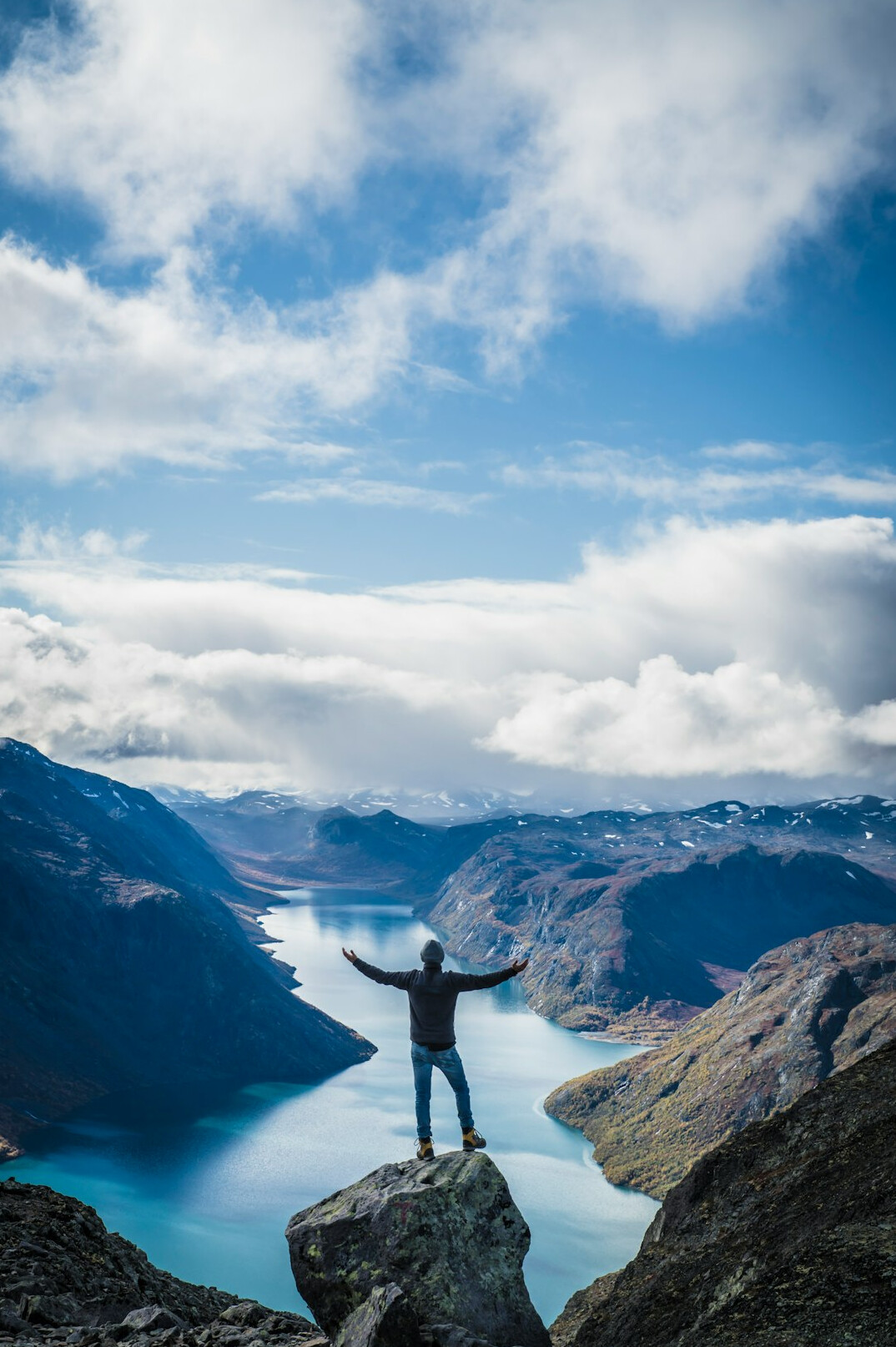 person standing confidently on mountain