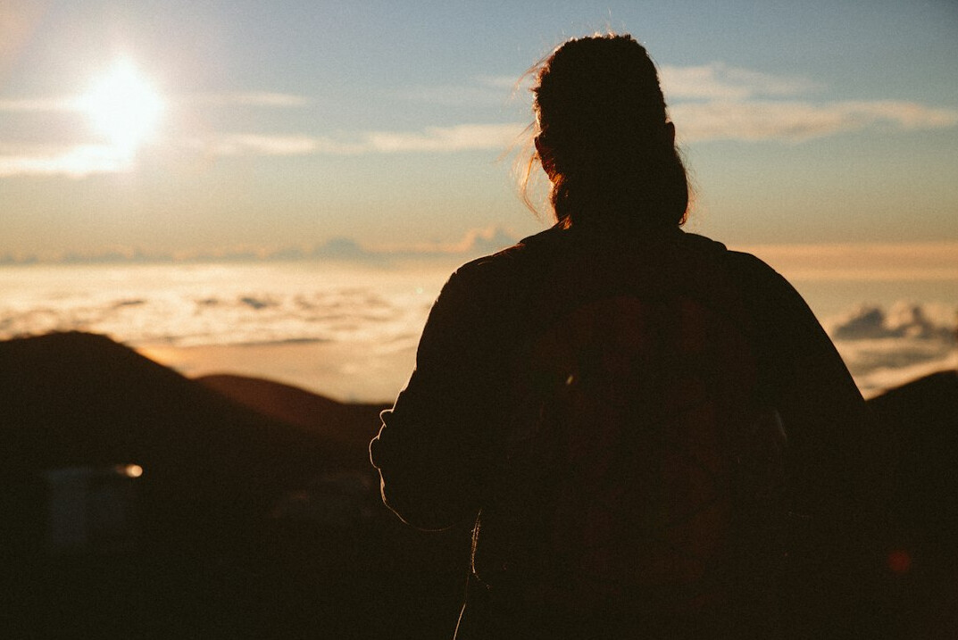 person looking at sunrise